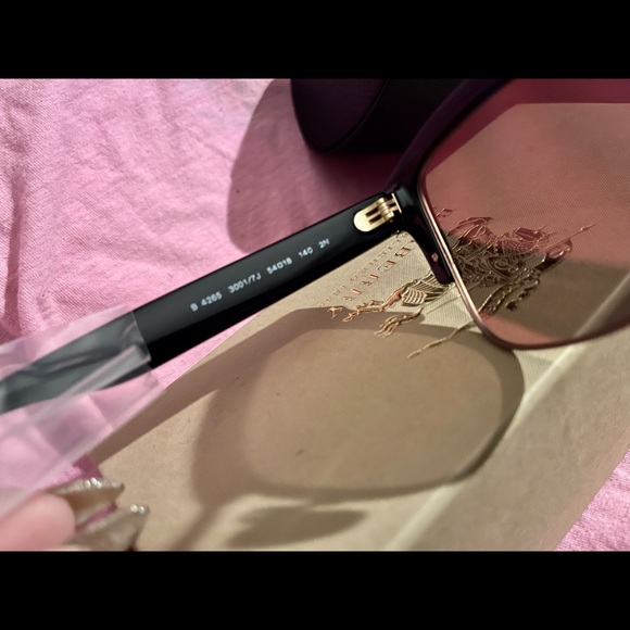 Burberry sunglasses. Gold reflect